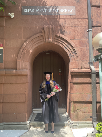 Sophie Ong in graduation robes outside Rutgers Art History Department.